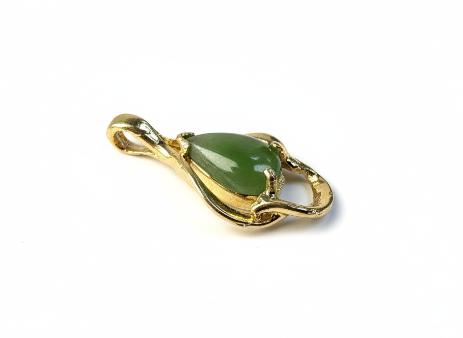 Gold plated teardrop pendant featuring green nephrite jade shown from a side angle