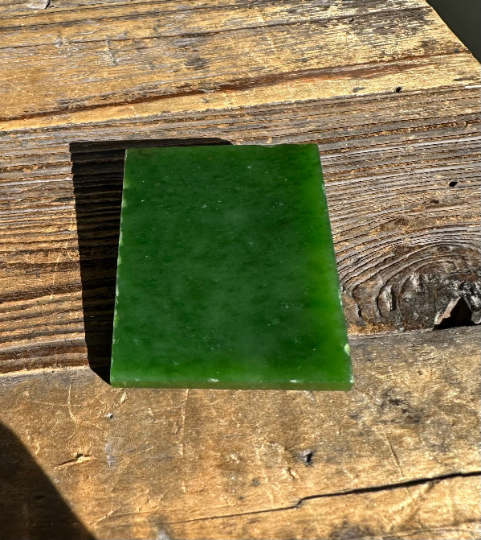 Smooth green A+ Siberian nephrite jade square slab with glossy finish.