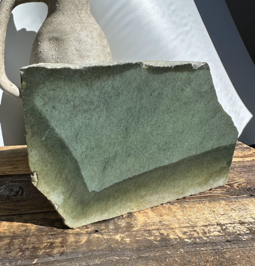 Wyoming Sage block on a weathered wooden surface with a ceramic vase in the background.