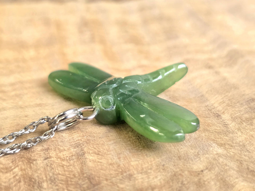 Back view of green jade dragonfly pendant on a silver chain