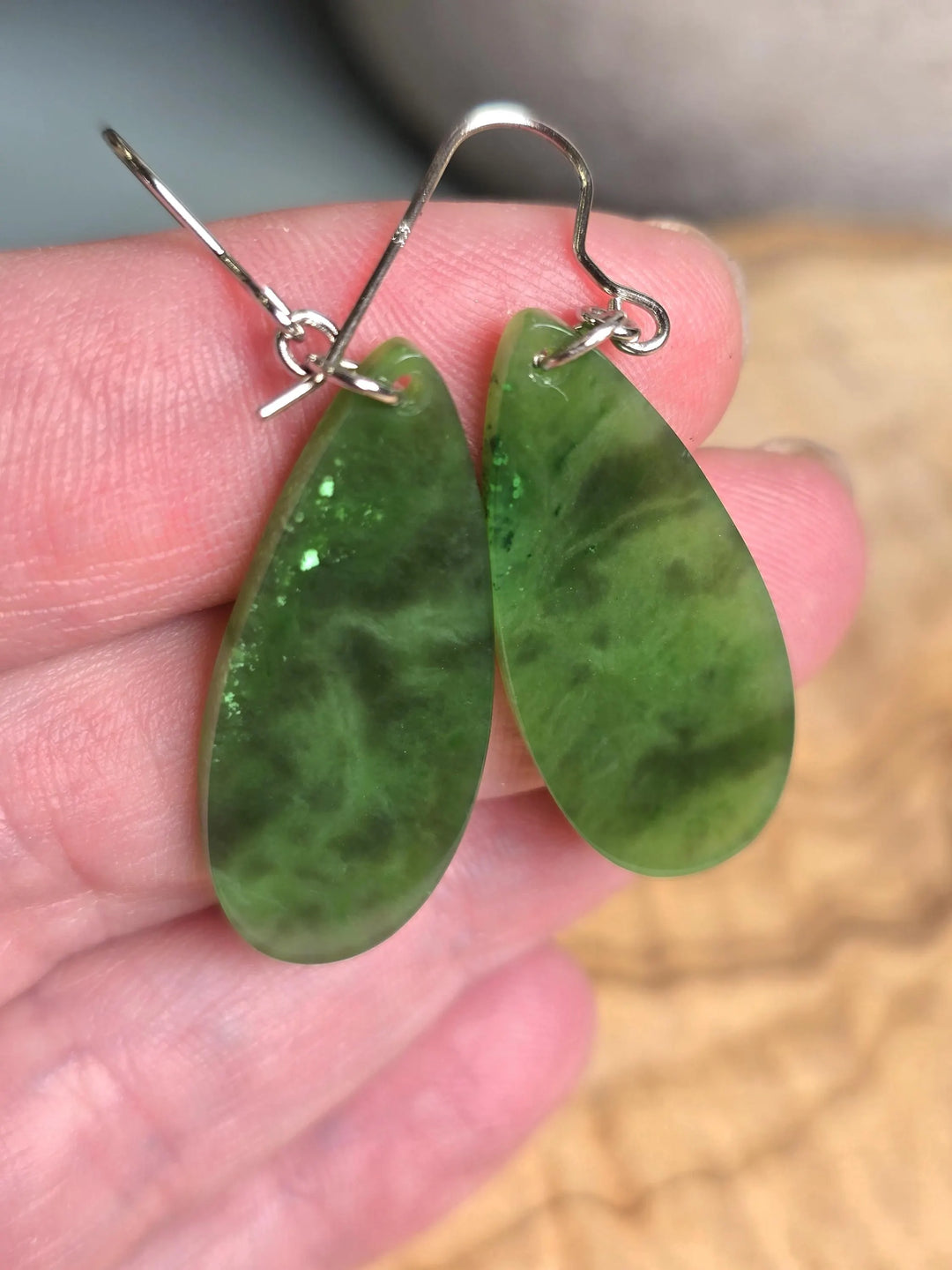 Green jade teardrop earrings with silver hooks