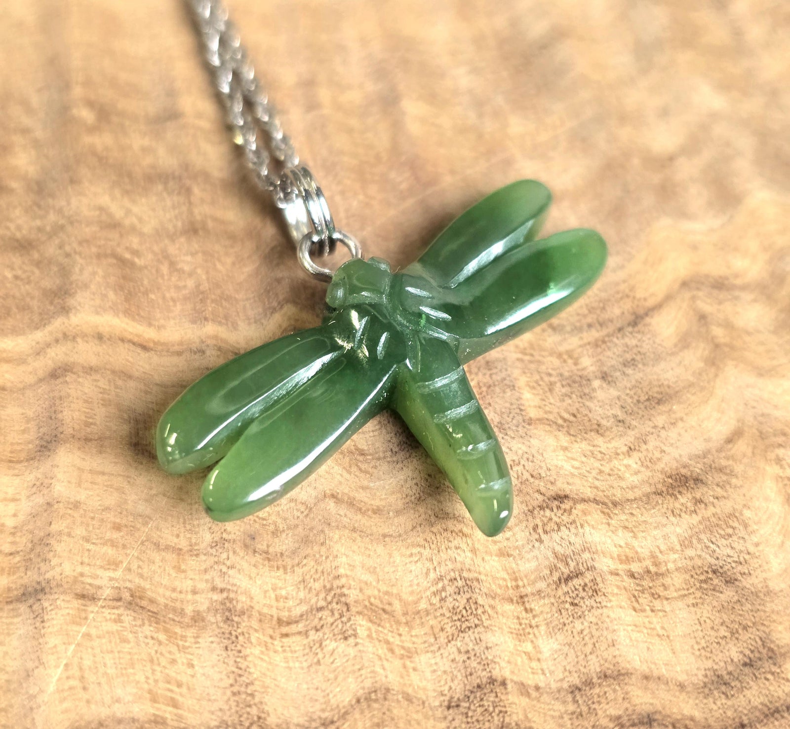 Green jade dragonfly pendant on a silver chain
