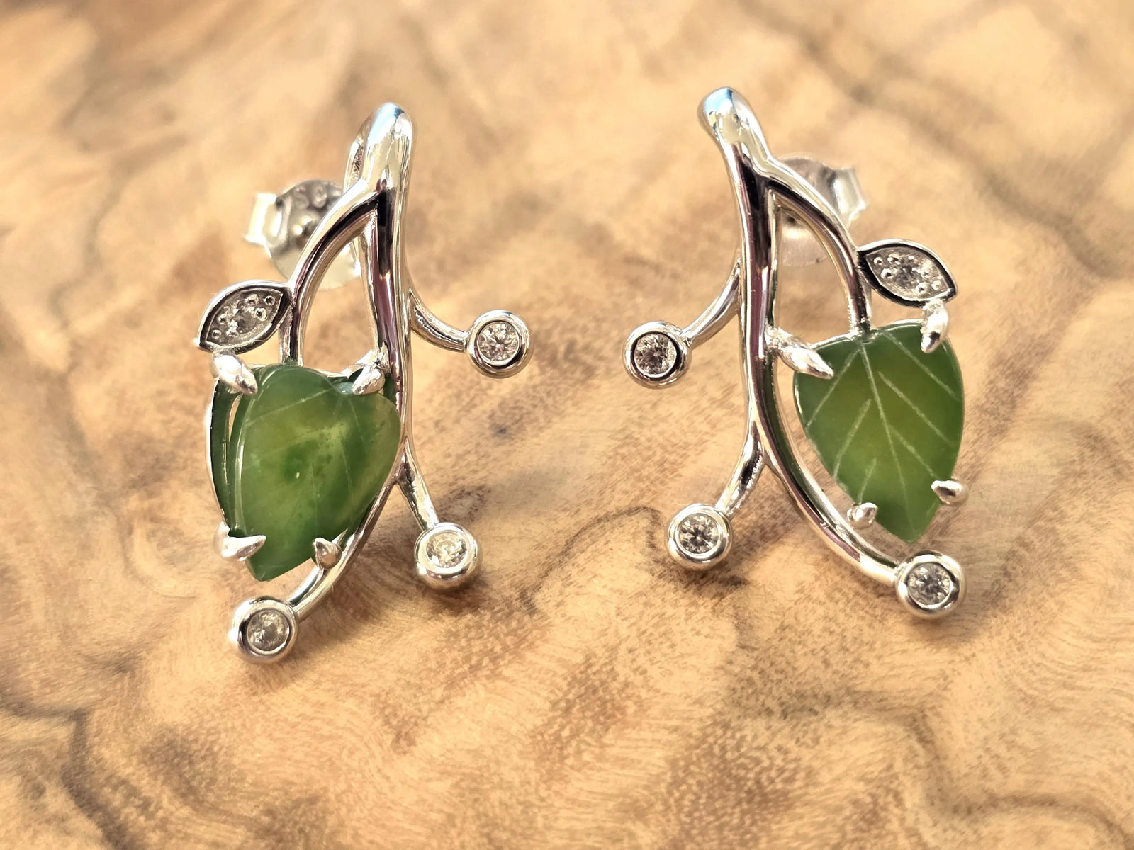 Canadian Jade Leaf and Silver Earrings featuring a green jade leaf pendant set in a silver vine with crystal accents.