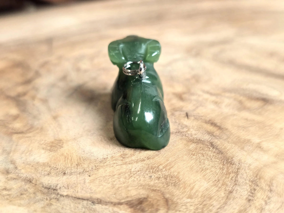 Dark green nephrite jade water buffalo charm with a metal loop bail on top