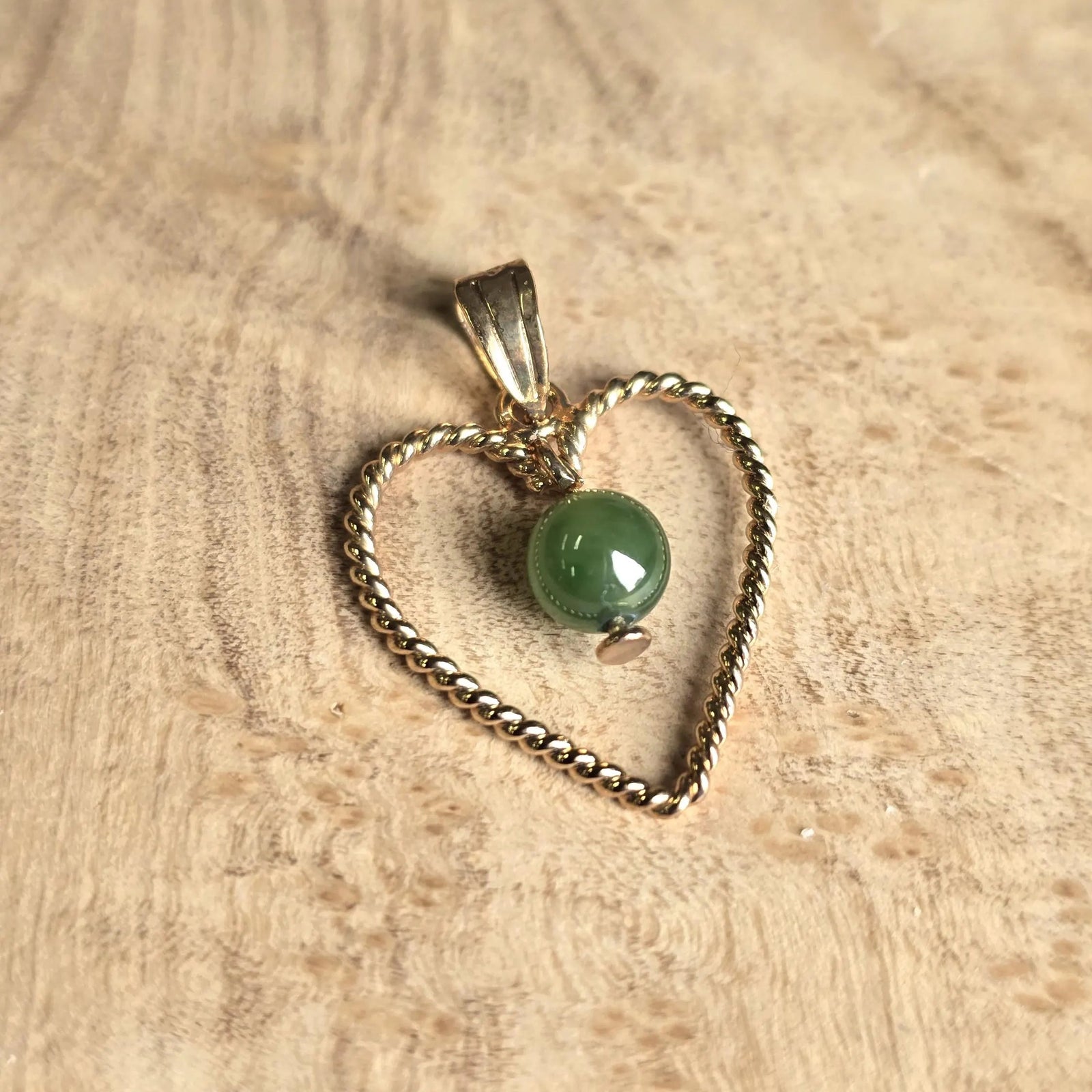 Vintage gold twisted rope heart pendant with a green nephrite jade bead.