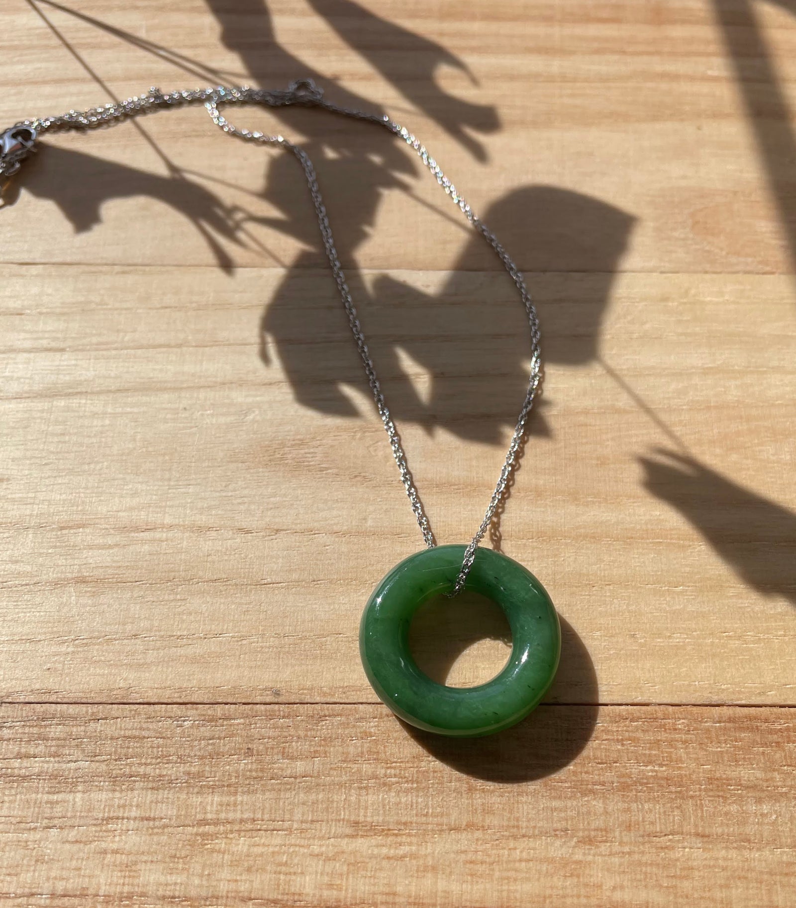 Round nephrite jade donut pendant 25mm on a silver chain