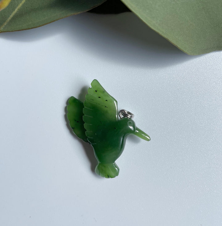 Green jade hummingbird pendant with a silver loop for a necklace