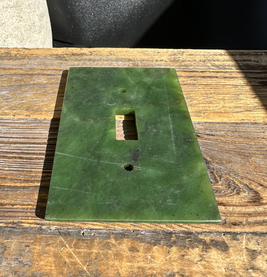 Green marble traditional style light switch plate with two screw holes and rectangular opening