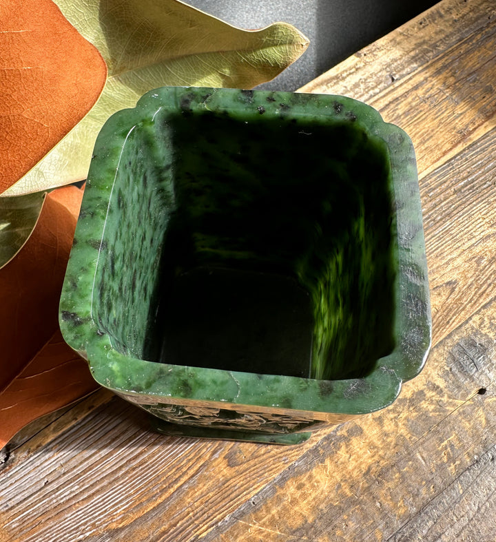 River Jade Vase Pen Holder with a square opening in rich green jade on a wooden surface