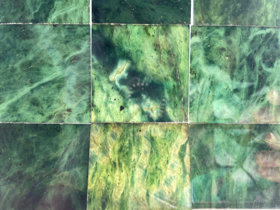Dark green Canadian Jade 2x2 inch tiles arranged in a grid showing swirling natural patterns.