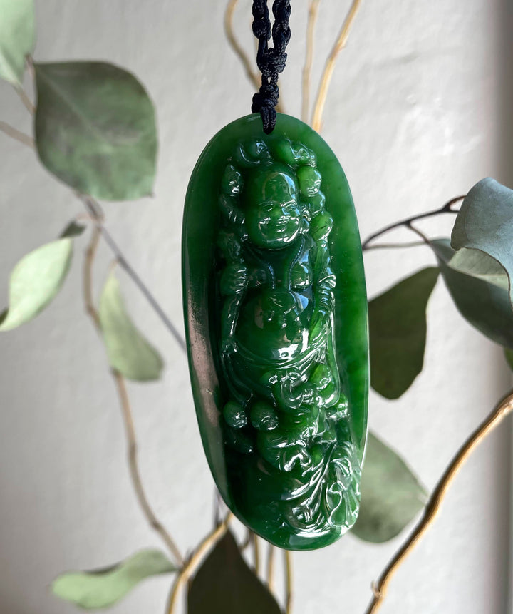 AA Siberian Jade Buddha pendant on a black cord with a glossy green oval jade pendant