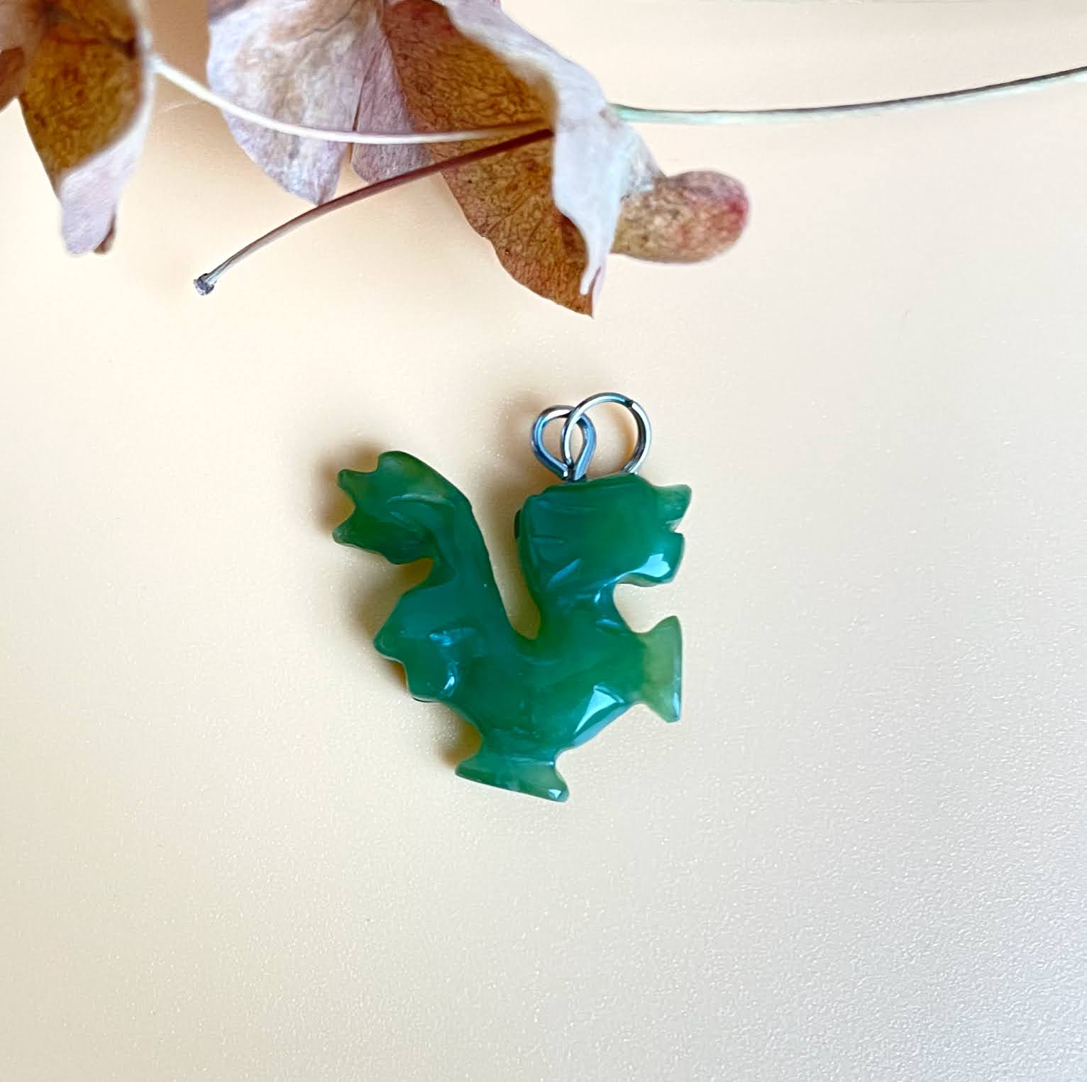 Green dragon walking charm pendant with a silver loop for necklace