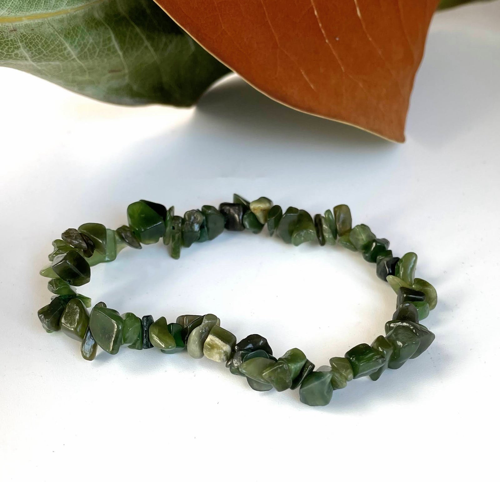 Nephrite jade chip bead bracelet with irregular green beads in assorted dark to light greens