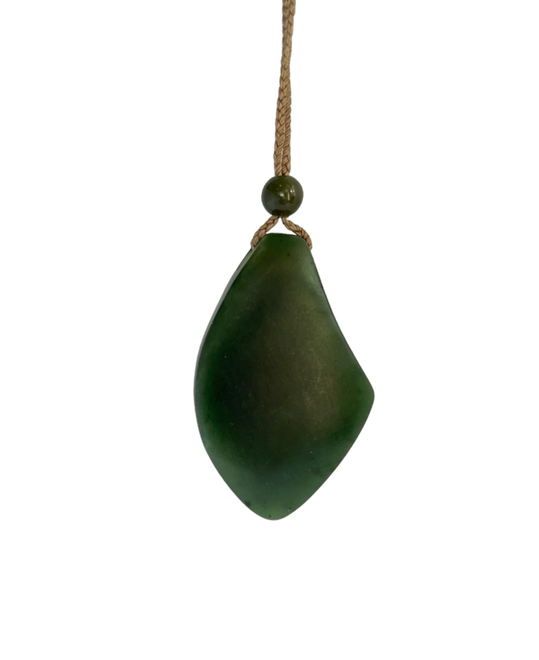 Close up front view of jade teardrop pendant with circular abalone inset on tan cord against white background