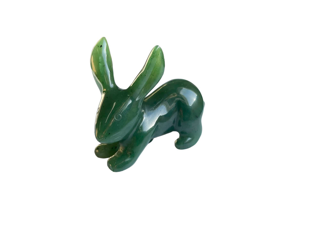 Glossy green jack rabbit carving on a white background