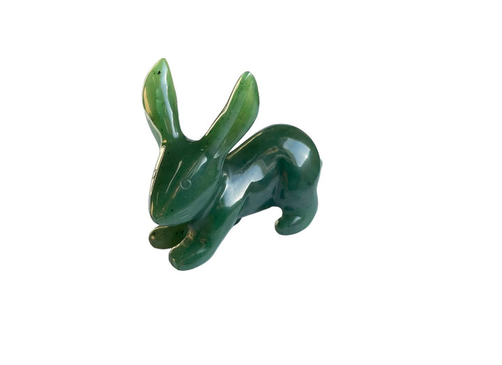 Glossy green jack rabbit carving on a white background