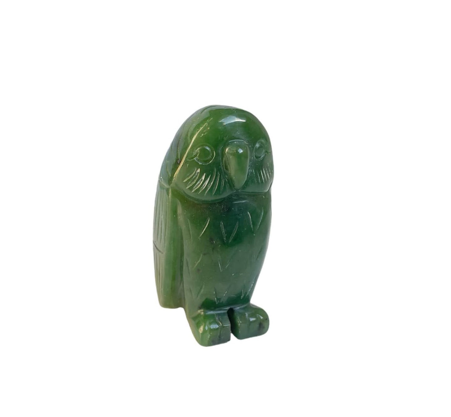 Green jade owl figurine with carved feather details and round eyes.