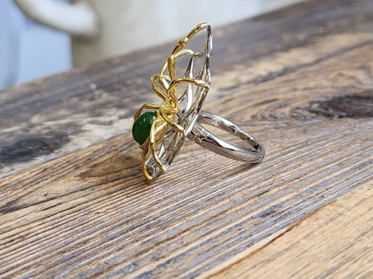 AA Spider Jade Ring with a gold spiderweb over a sterling silver band and a green jade centerpiece