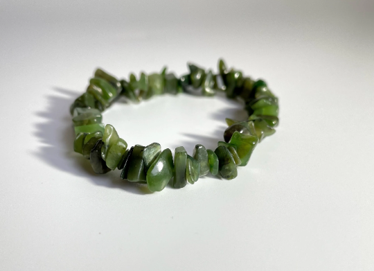 Nephrite jade chip bead bracelet laid flat on white background