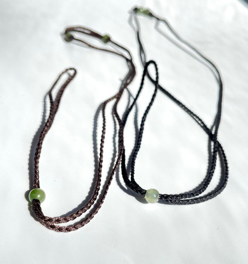Two tone dark brown and black cord necklace with jade beads and looped ends