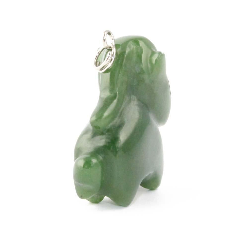 Side view of green jade cartoon horse pendant with a metal hanging loop.
