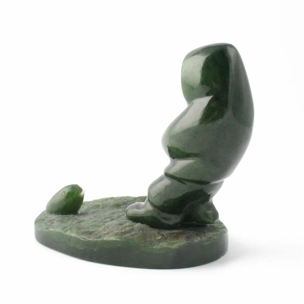 Canadian nephrite jade fisherman catching a seal on a green base