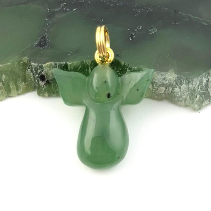 Green jade angel pendant with a gold loop bail.