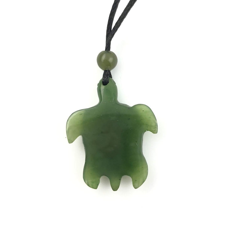 Back view of jade turtle pendant on black cord with bead