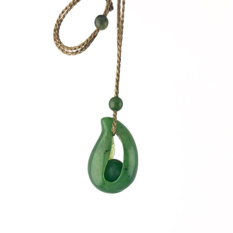 Jade Pendant with jade bead inside, 1.25"