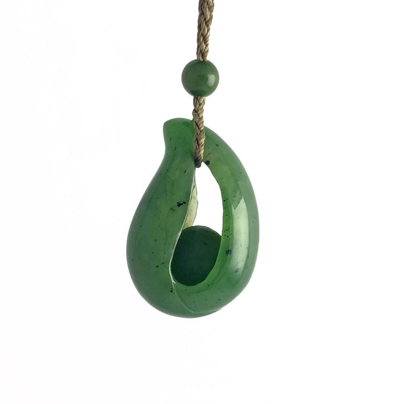 Canadian Jade pendant with bead inside