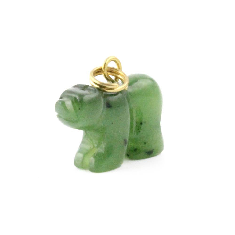 Green jade bear charm with a white background 