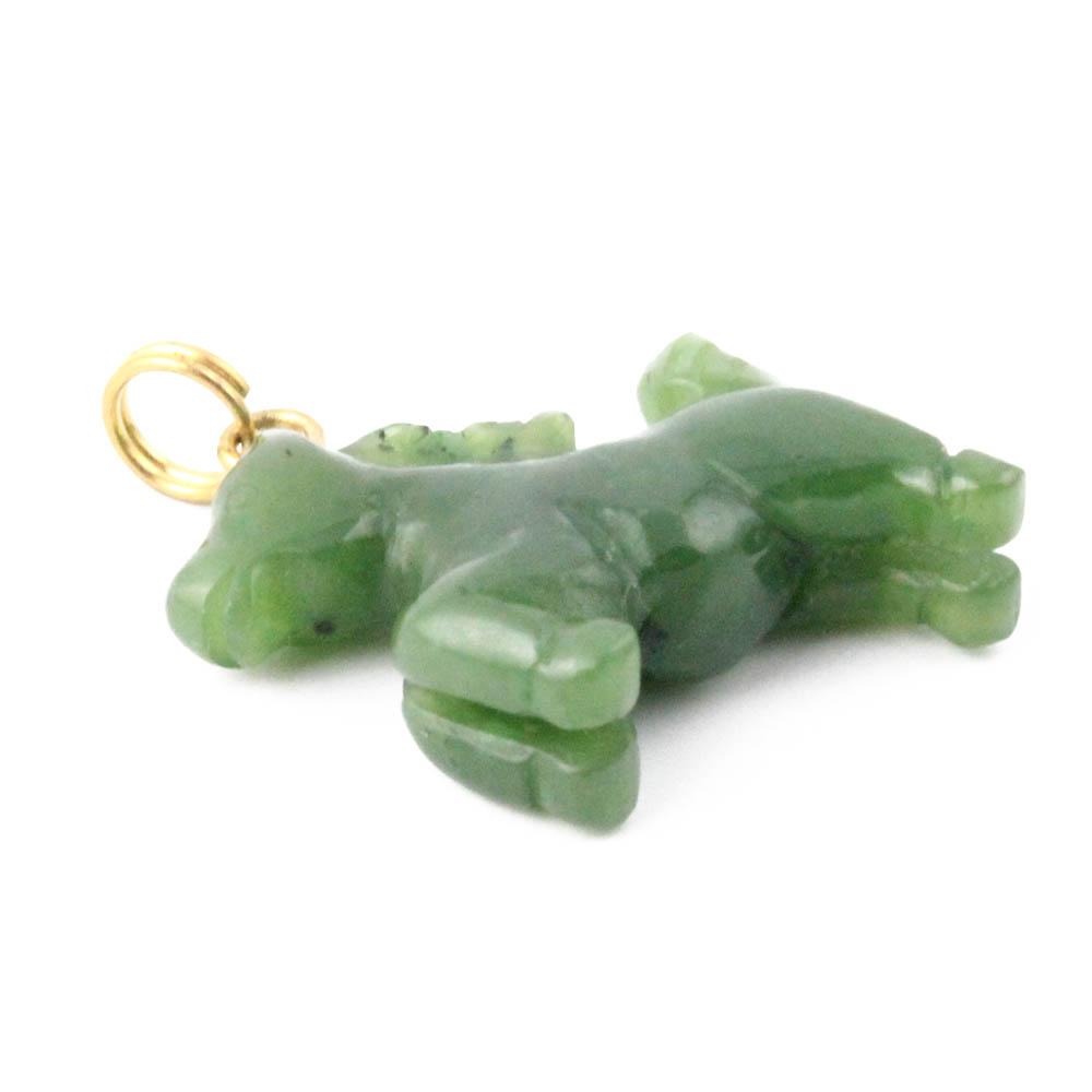 Close up of green jade horse pendant showing carved details and gold bail