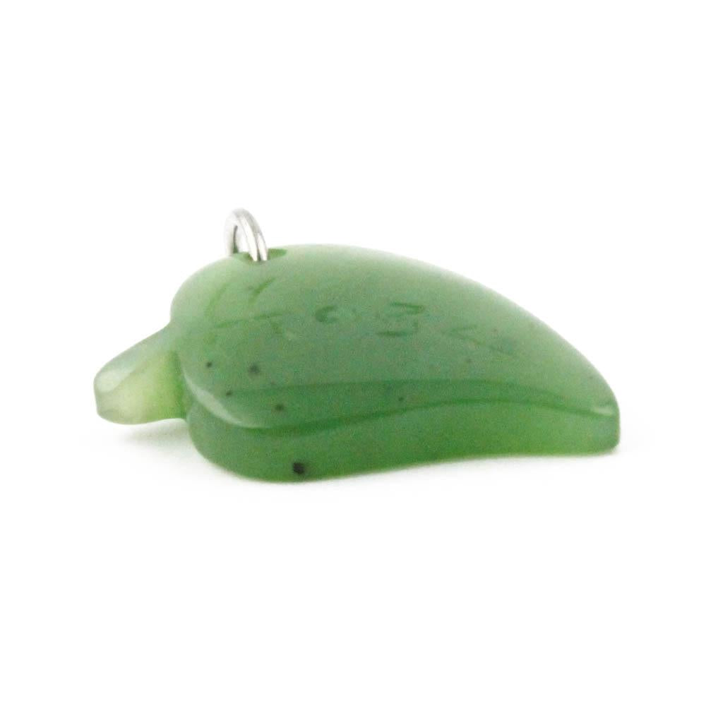 Green jade leaf charm pendant with a silver bail