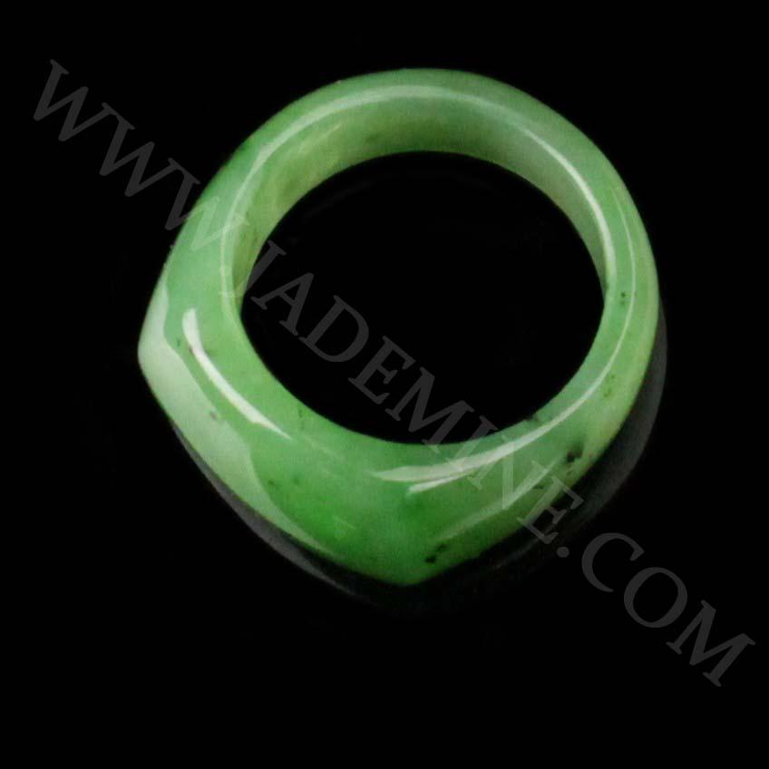 Green jade saddle top band ring with a smooth glossy finish.