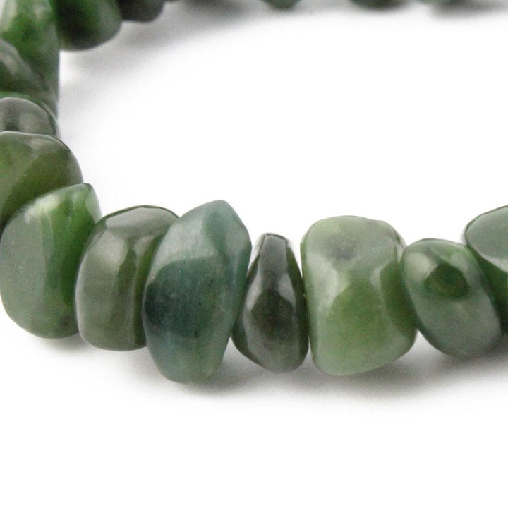 Close-up of green nugget beads on a string
