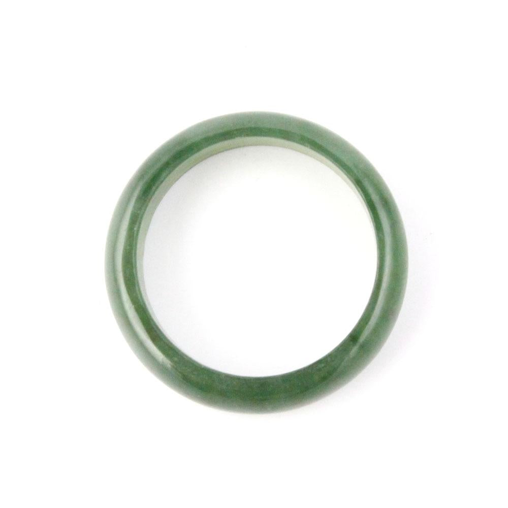 Close up of a narrow jade green band ring 5mm on a white background