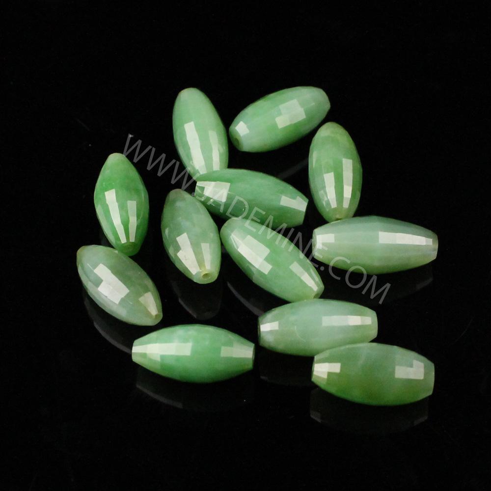 A Grade faceted Siberian Beads 9x18mm pale green on black background