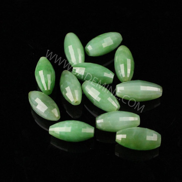 A Grade faceted Siberian Beads 9x18mm pale green on black background