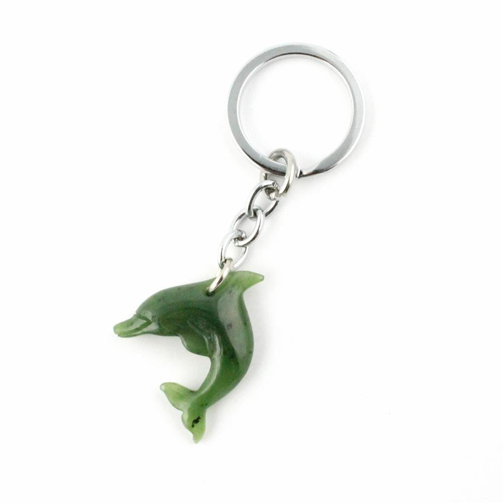 Green dolphin keychain charm on a silver chain and ring.