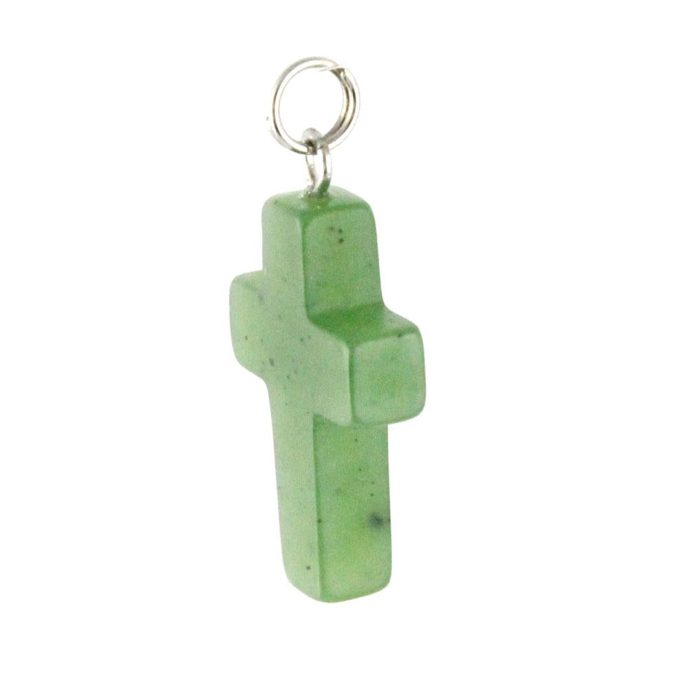 Small jade cross pendant with a silver loop bail on a white background