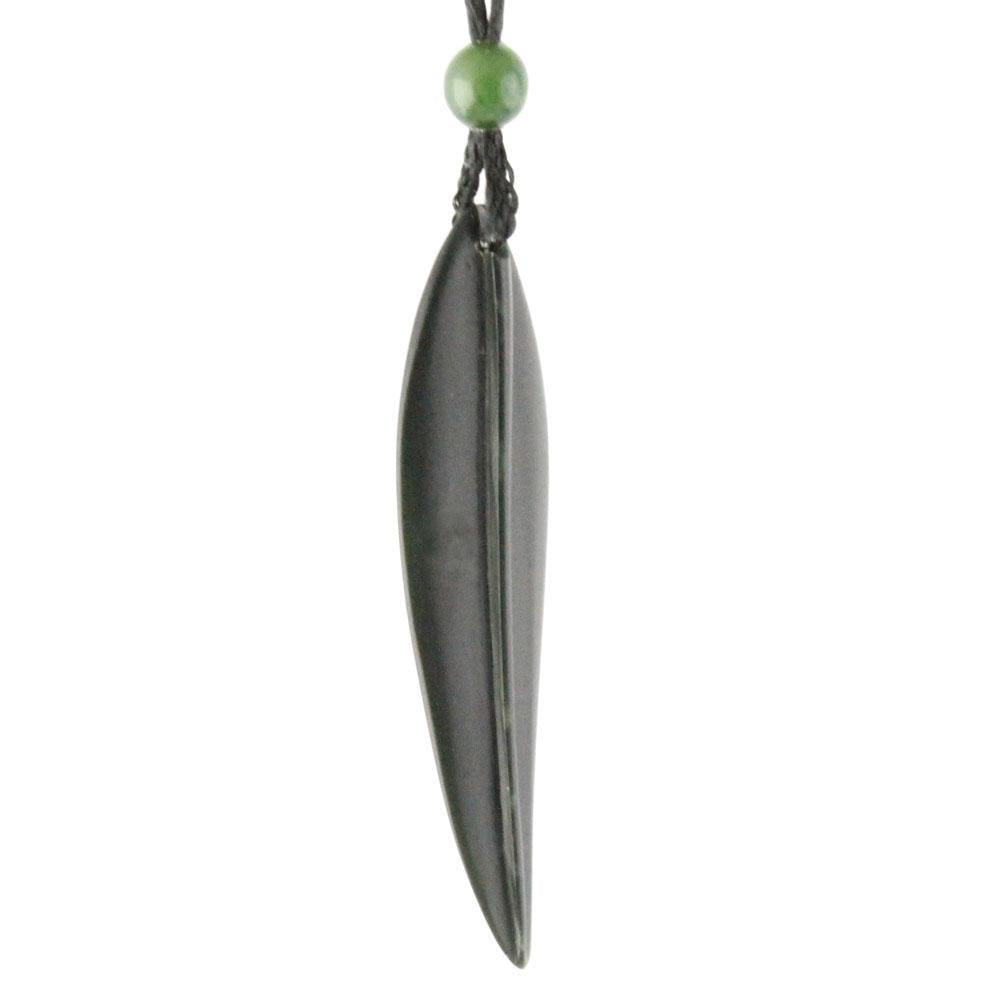Long dark leaf pendant with green bead at top on a cord