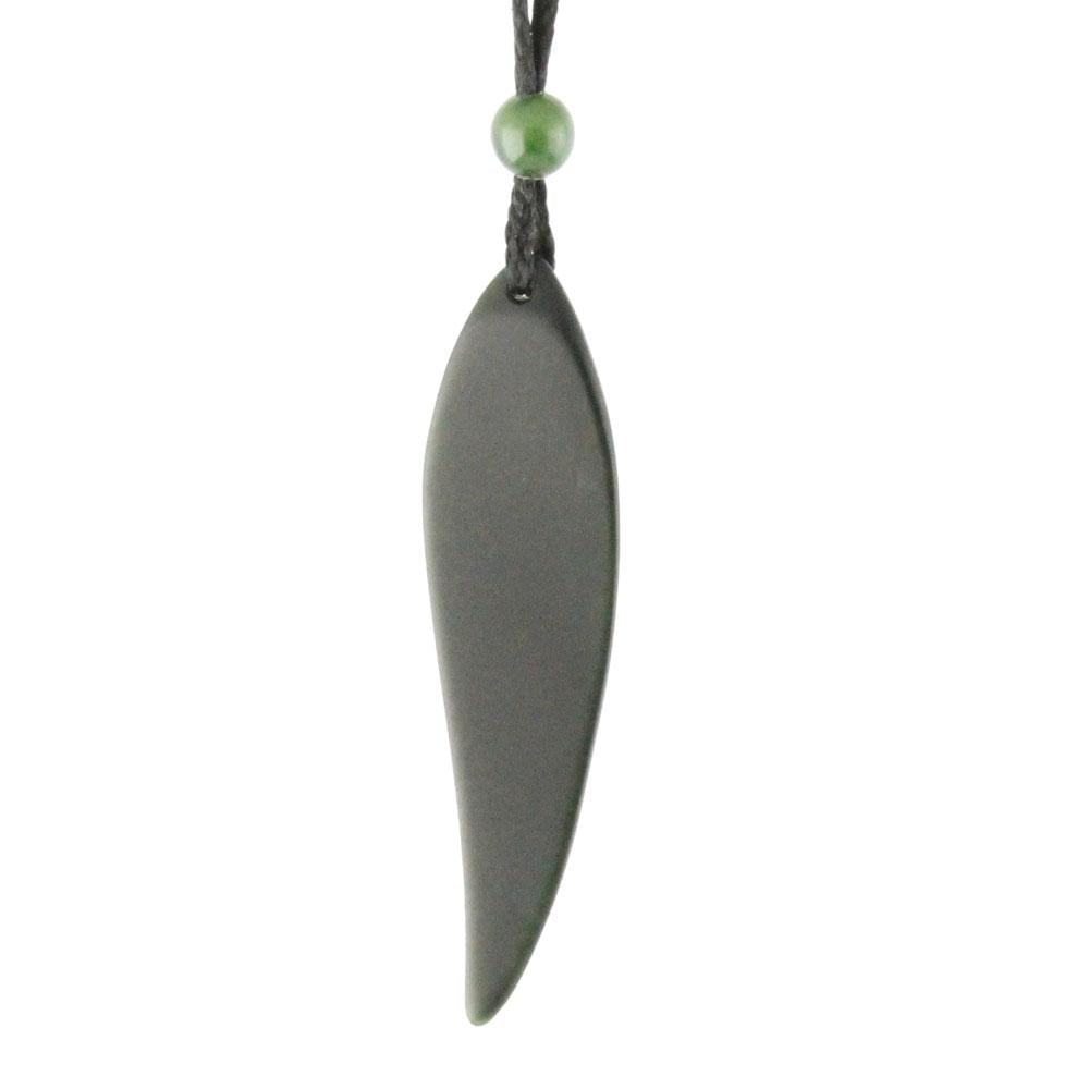 Front view of leaf pendant showing a gray elongated leaf with green bead on a black cord