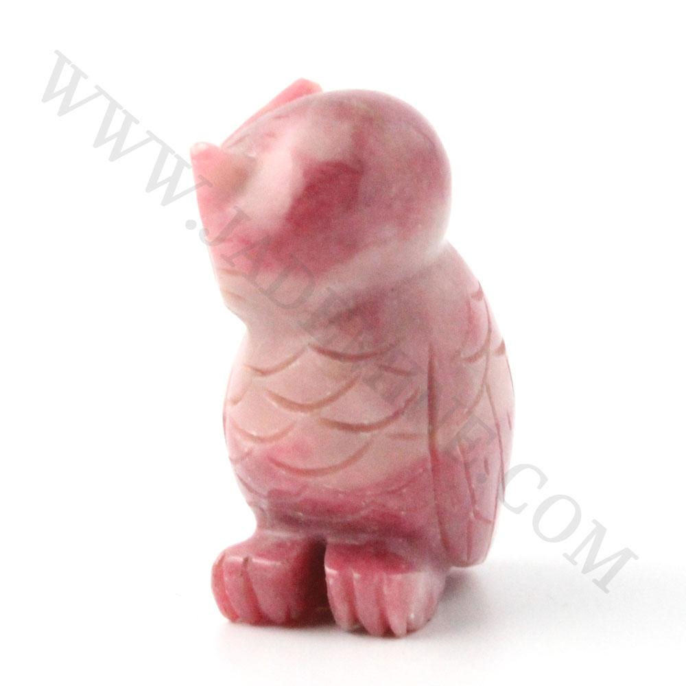 Pink rhodonite owl figurine with carved feather details