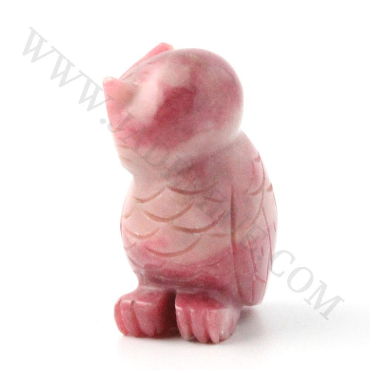 Pink rhodonite owl figurine with carved feather details