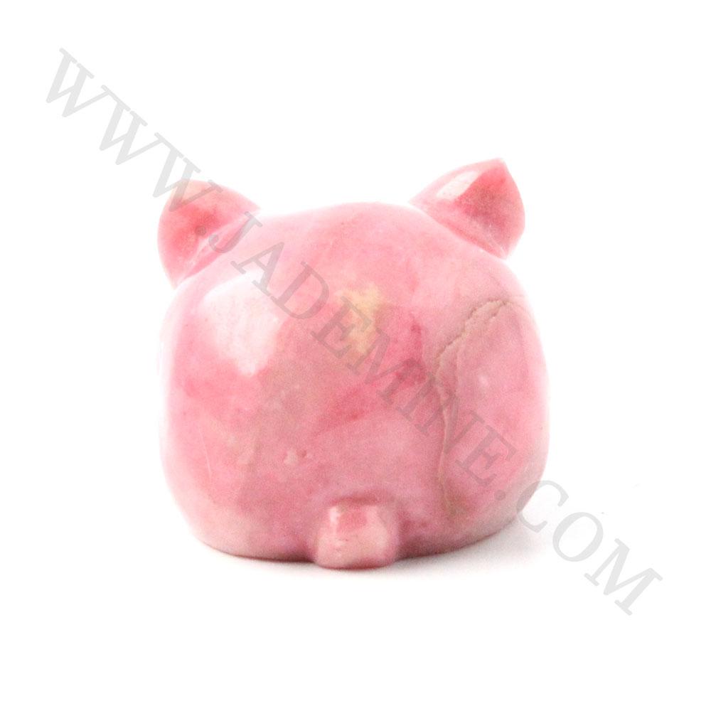 Pink rhodonite rabbit sculpture shown from behind with a rounded body and ears