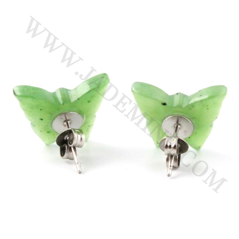Pair of green butterfly stud earrings with silver posts photographed on a white background.