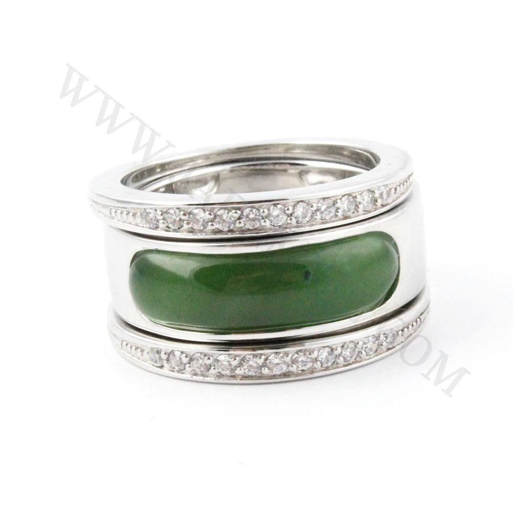Sterling silver ring featuring a wide green nephrite jade centerpiece with diamond accented bands