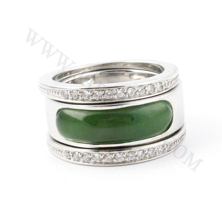 Sterling silver ring featuring a wide green nephrite jade centerpiece with diamond accented bands