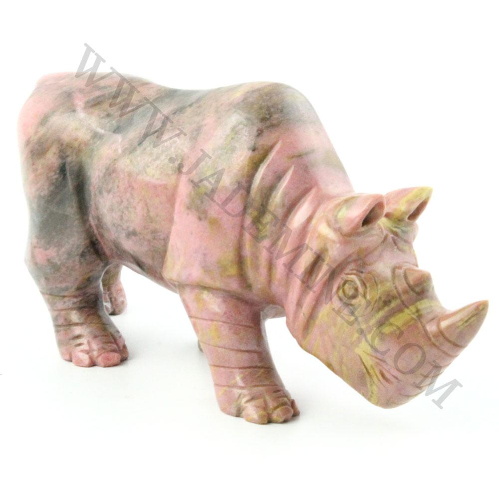 5 inch Rhodonite rhinoceros sculpture in pink marble tones shown from a three quarter front view.
