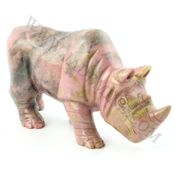 5 inch Rhodonite rhinoceros sculpture in pink marble tones shown from a three quarter front view.